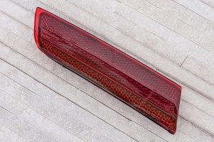 VOLKSWAGEN TOUAREG II 7P 2014-2018 PO FACELIFTINGU ODBLASK TYLNEGO ZDERZAKA PRAWY 7P6945106A