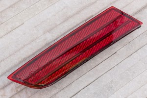 VOLKSWAGEN TOUAREG II 7P 2014-2018 PO FACELIFTINGU ODBLASK TYLNEGO ZDERZAKA PRAWY 7P6945106A